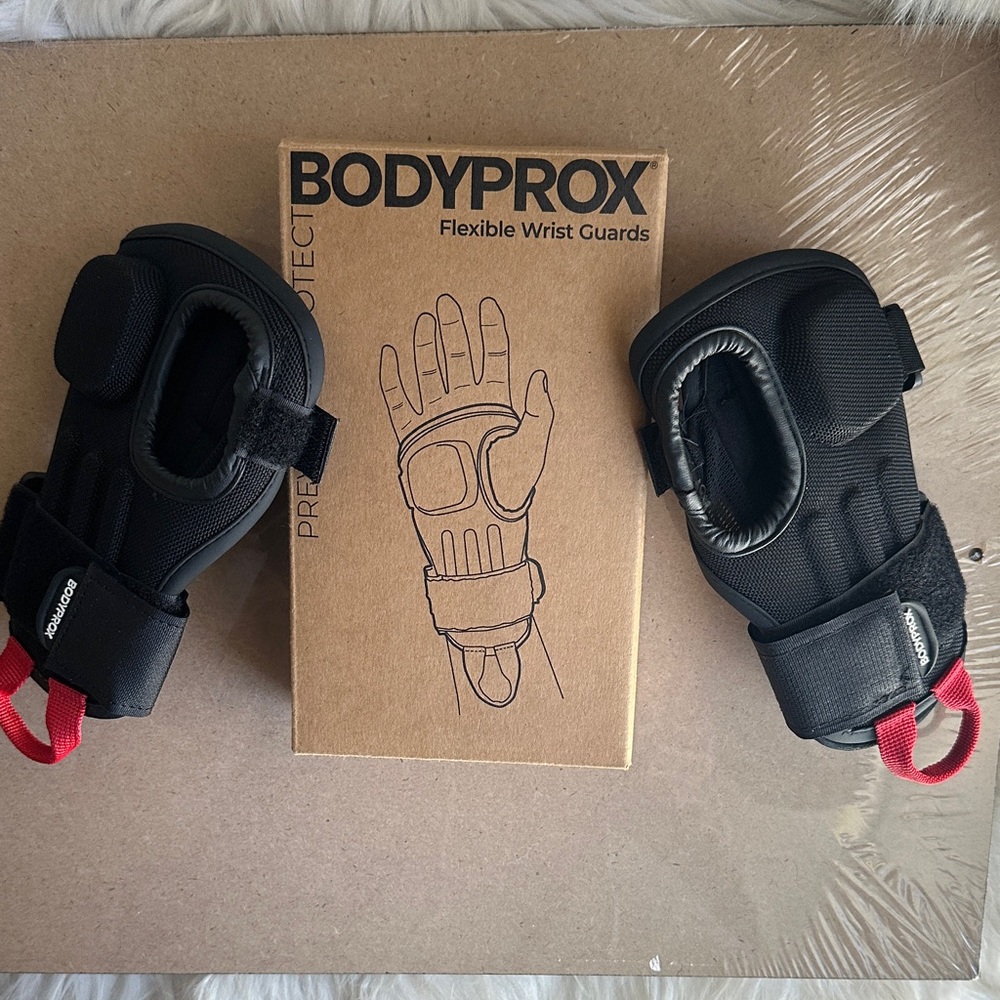 Black Flexible Wrist Guards with Red Pull Tabs